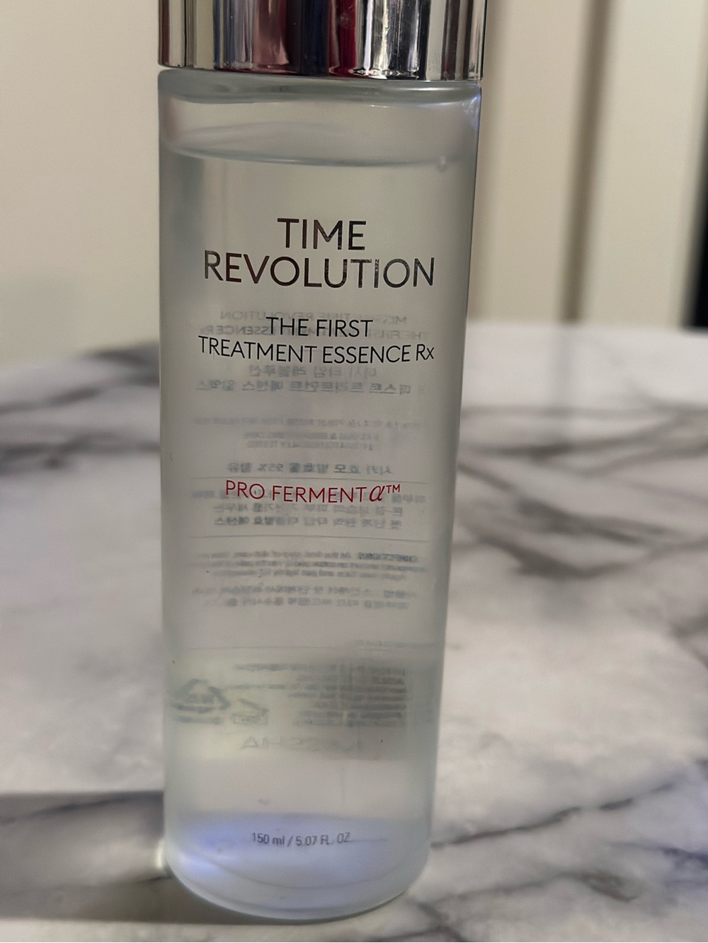 Revolution Clear Skincare Essence with Silver Cap and Frosted White Bottle
